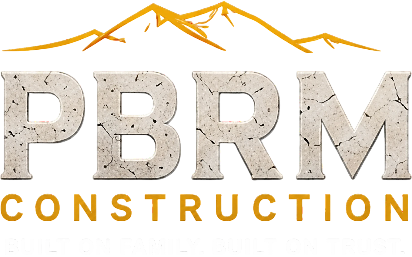 PBRM Construction logo with mountains and tagline